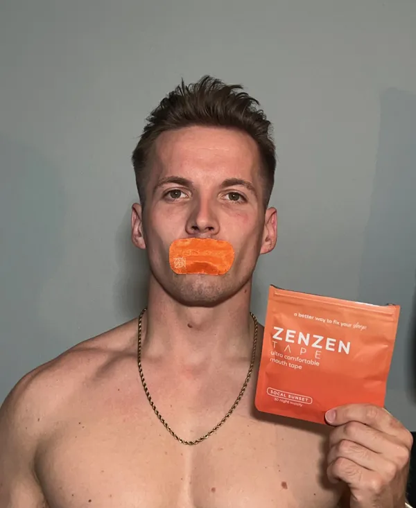 Man wearing orange Zenzen tape with the SoCal Sunset pouch