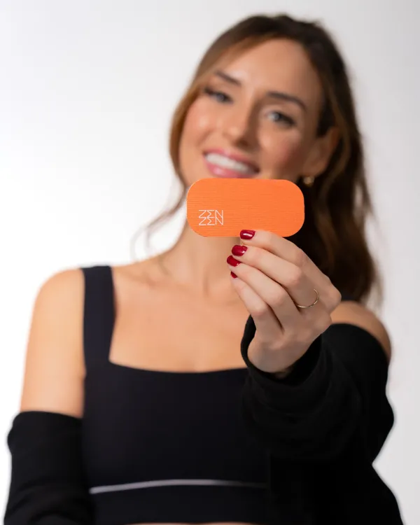 Woman holding a SoCal Sunset Zenzen strip